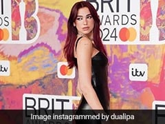 Dua Lipa Makes A Bewitching Entry In A Black Versace Dress On The 2024 Brits Awards Red Carpet