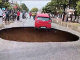 Video : Car Hangs On Edge Of Giant Pothole As Lucknow Road Caves In After Rain